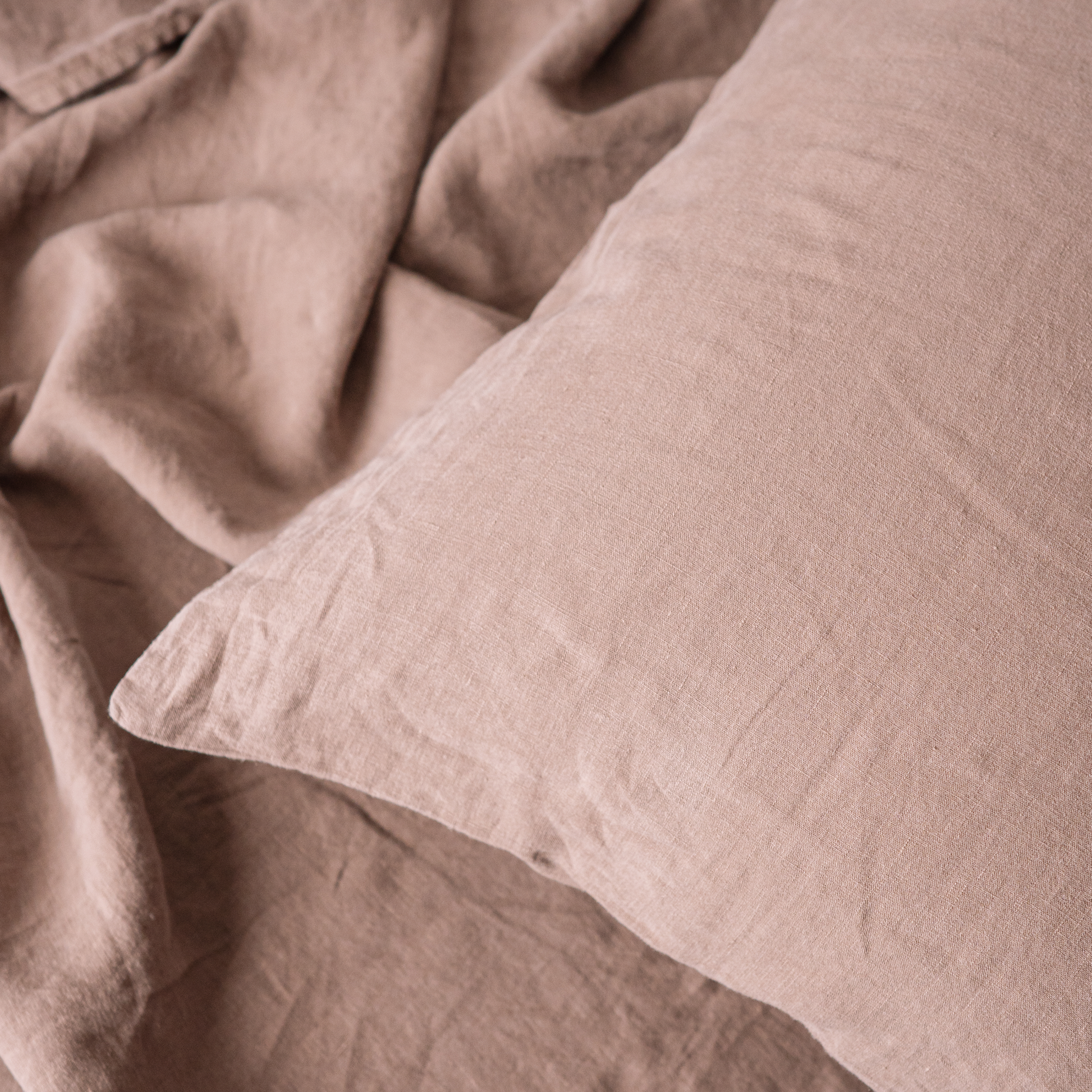 Closeup of a basic linen LEWSII pillowcase in Cappuccino color