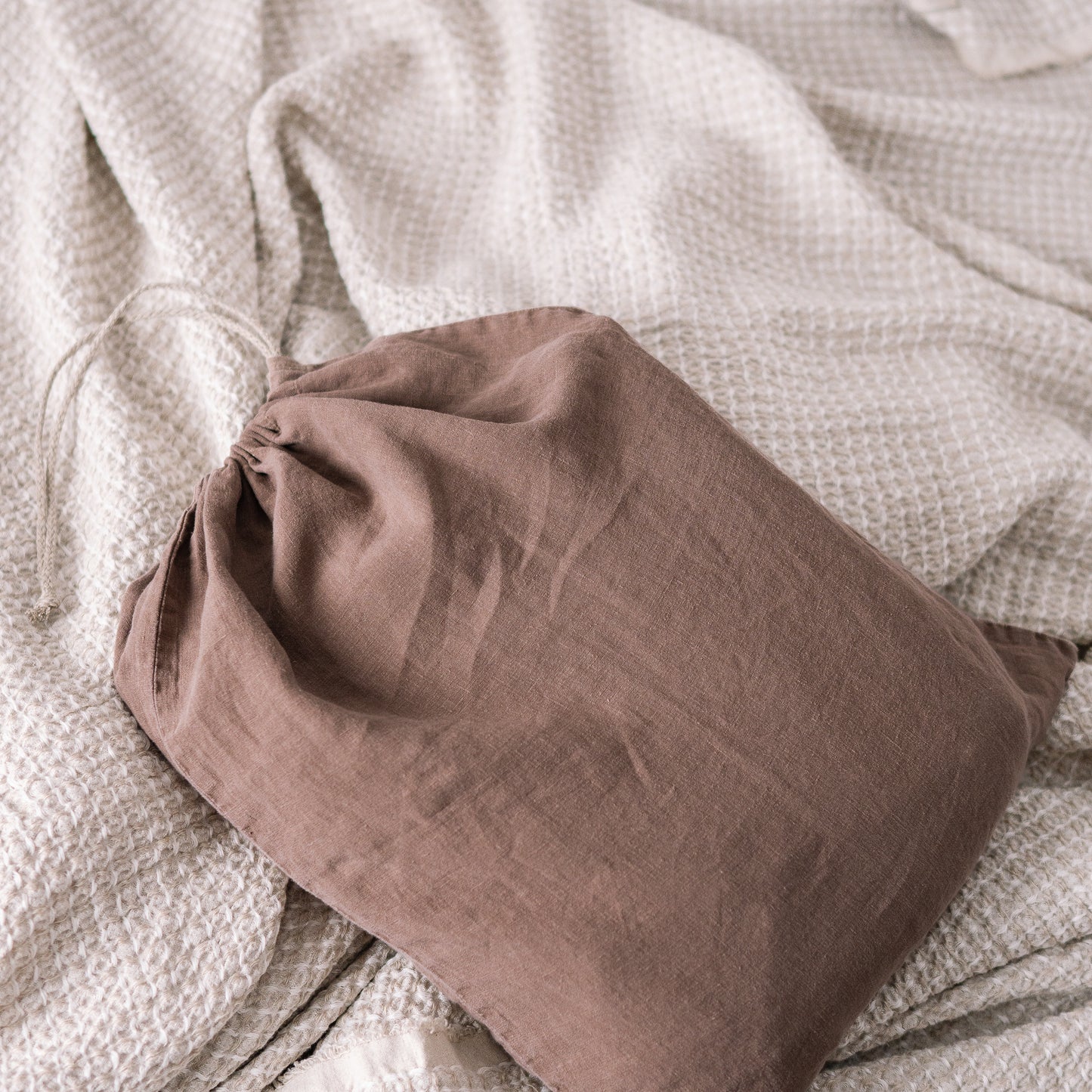 Close up of Lewisii linen laundry bag in cappuccino color. Duvet cover package.