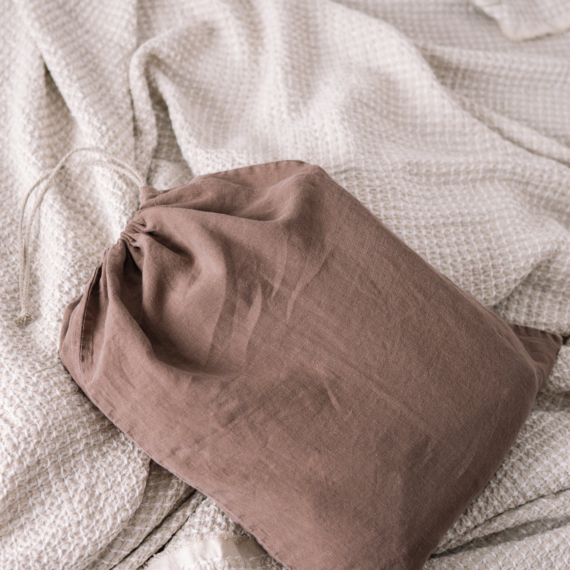 Close up of Lewisii linen laundry bag in cappuccino color. Duvet cover package.