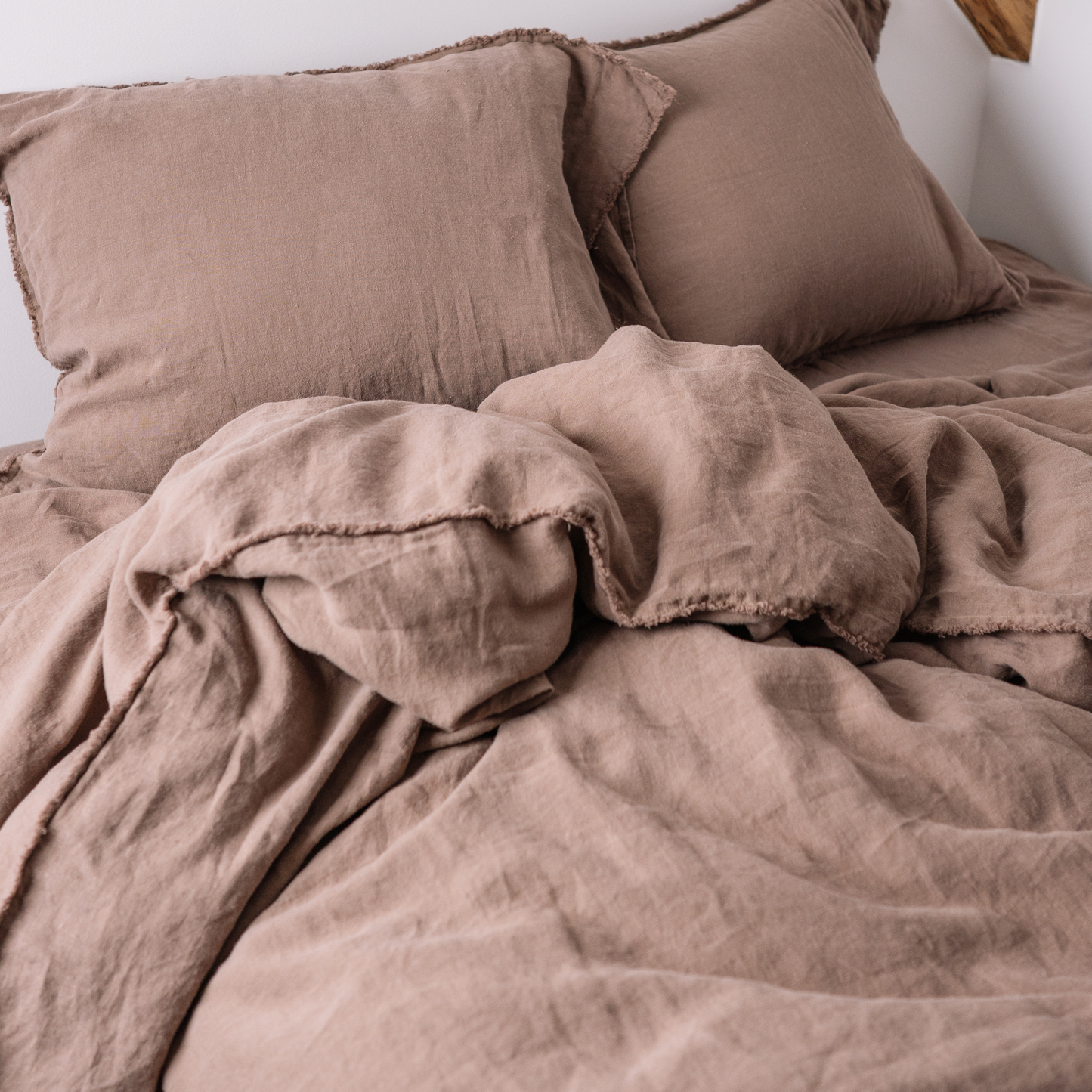 Cappuccino color Lewisii linen duvet cover close up in monochrome set 