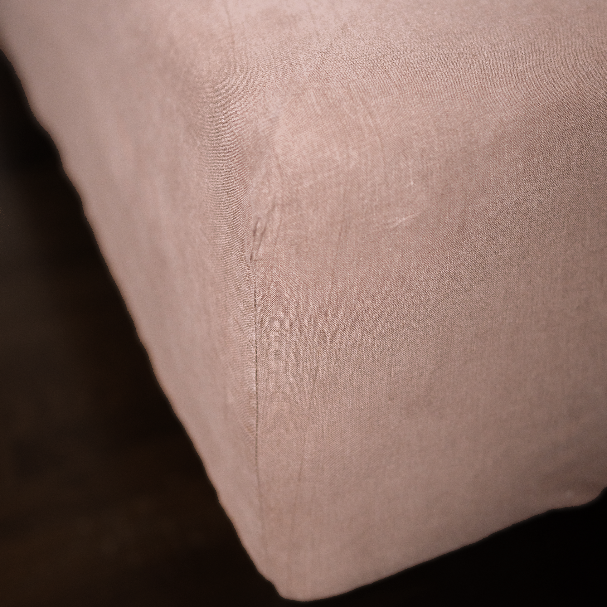 Cappuccino color fitted sheet close up photo with seam line