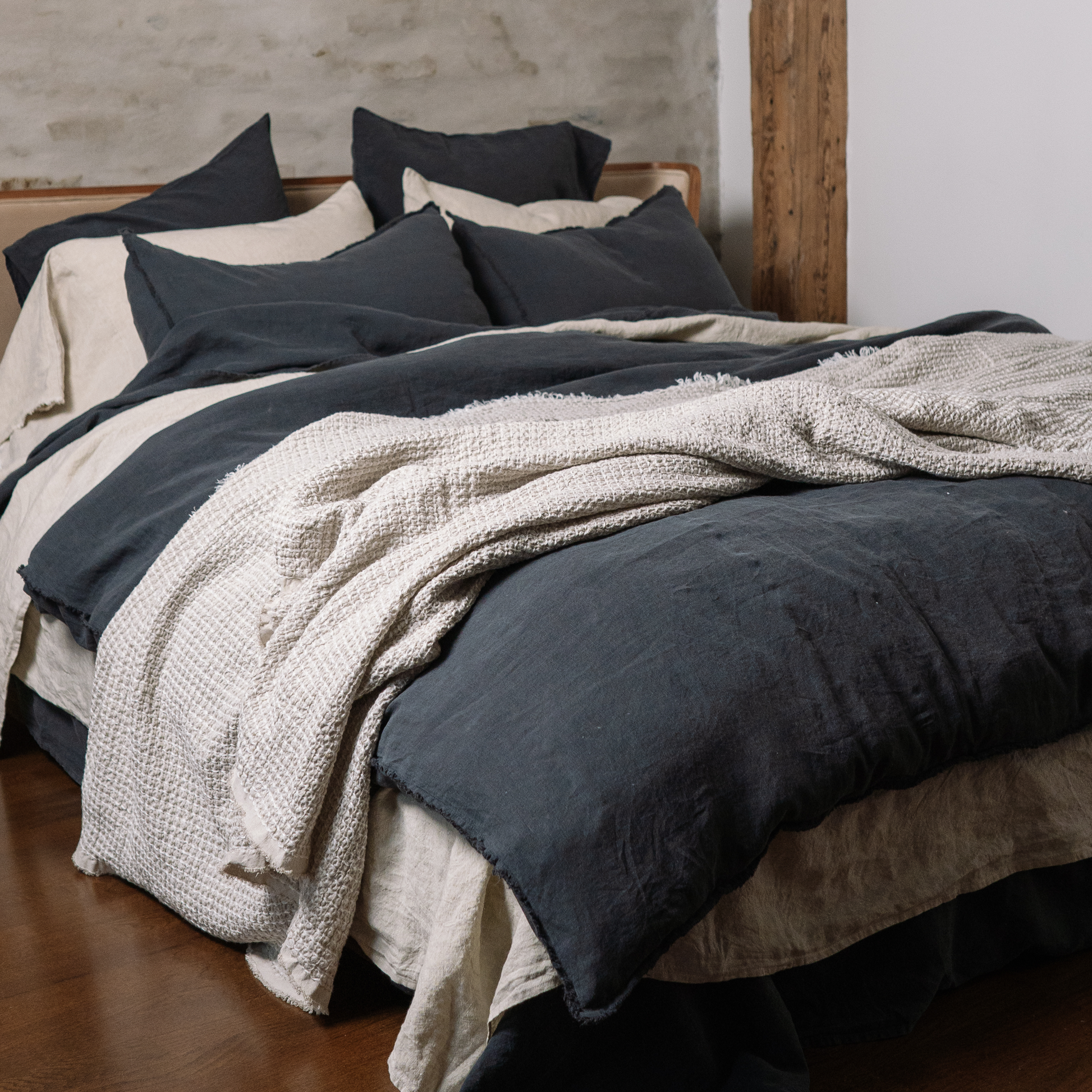 Sandy color flat sheet in mix and match combination with dark grey color bedding
