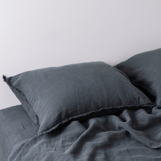Two pillows in LEWSII pillowcases in Dark Grey color