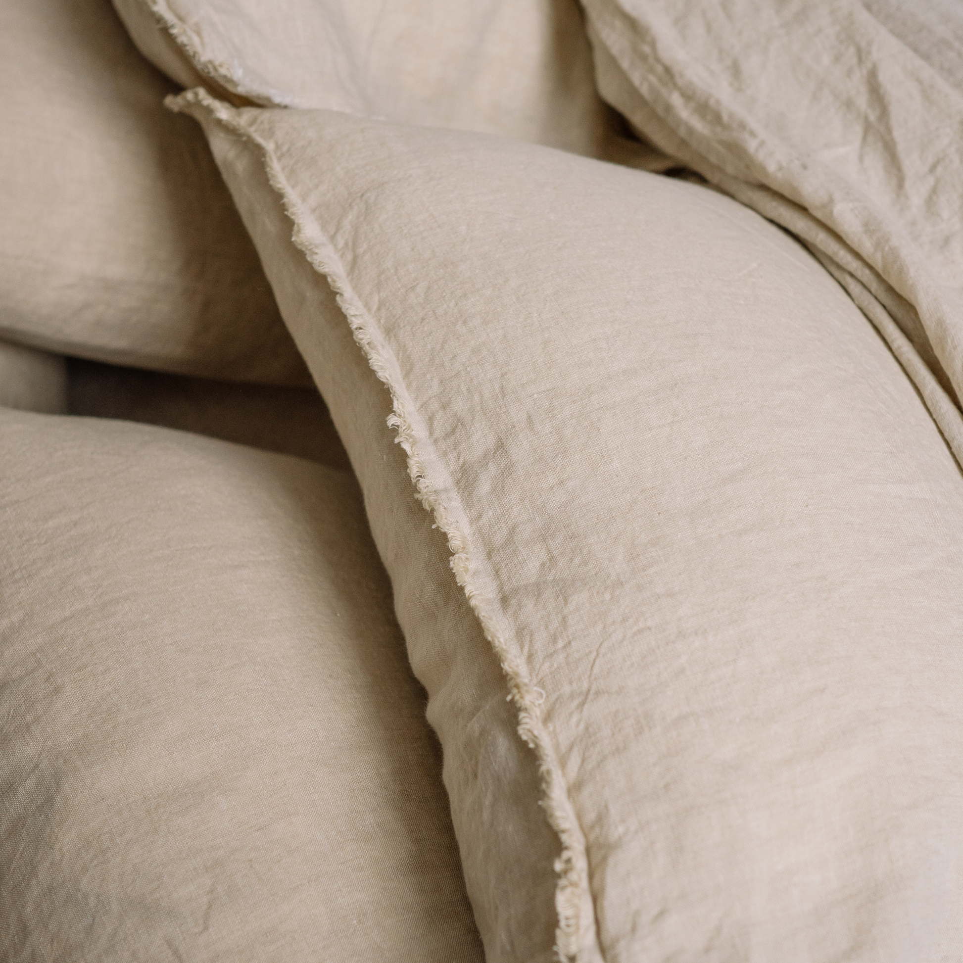 A closeup of a couple of pillowcases in Sandy color