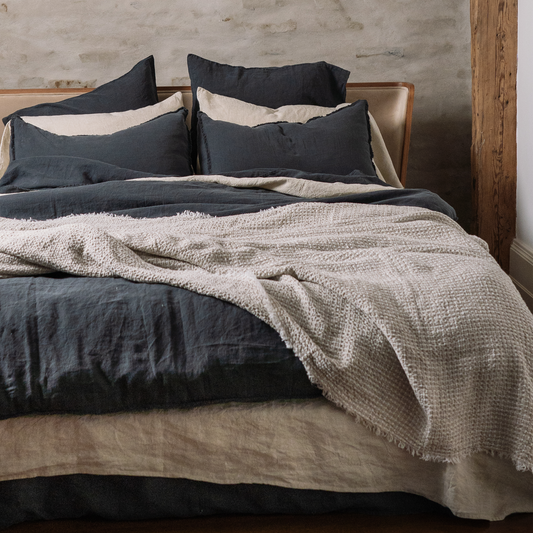 Linen waffle blanket on bed combination  with dark grey and sandy bedding set 