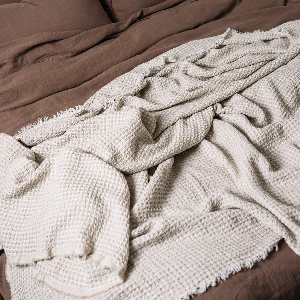Linen waffle blanket in sandy color close up