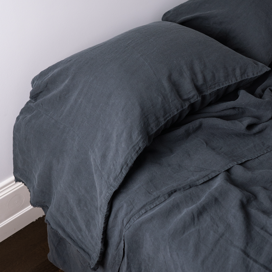 Long Linen Dark Grey Pillowcase on a bed